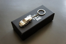 NIB Aston Martin DBS Superleggera 007 James Bond Silver Keychain Key Ring 1/87 picture