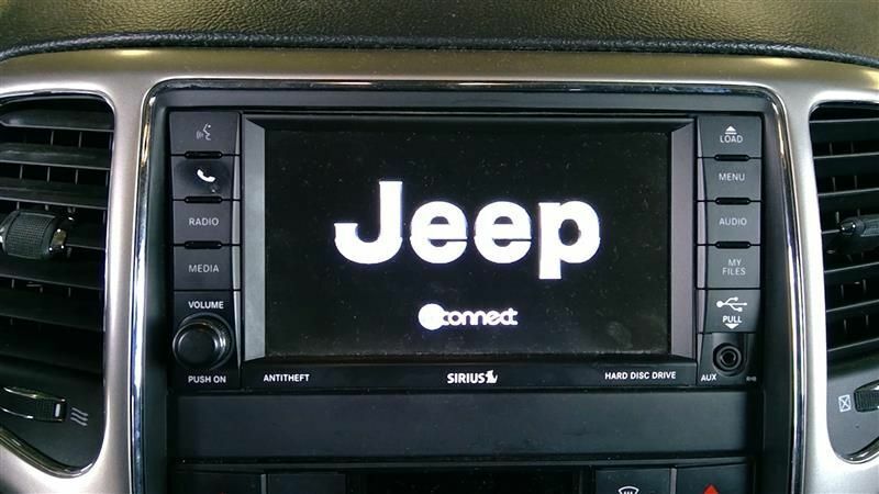 2012 Jeep Grand Cherokee Radio w/ Navigation Sat CD DVD HDD Face ID RHB OEM 