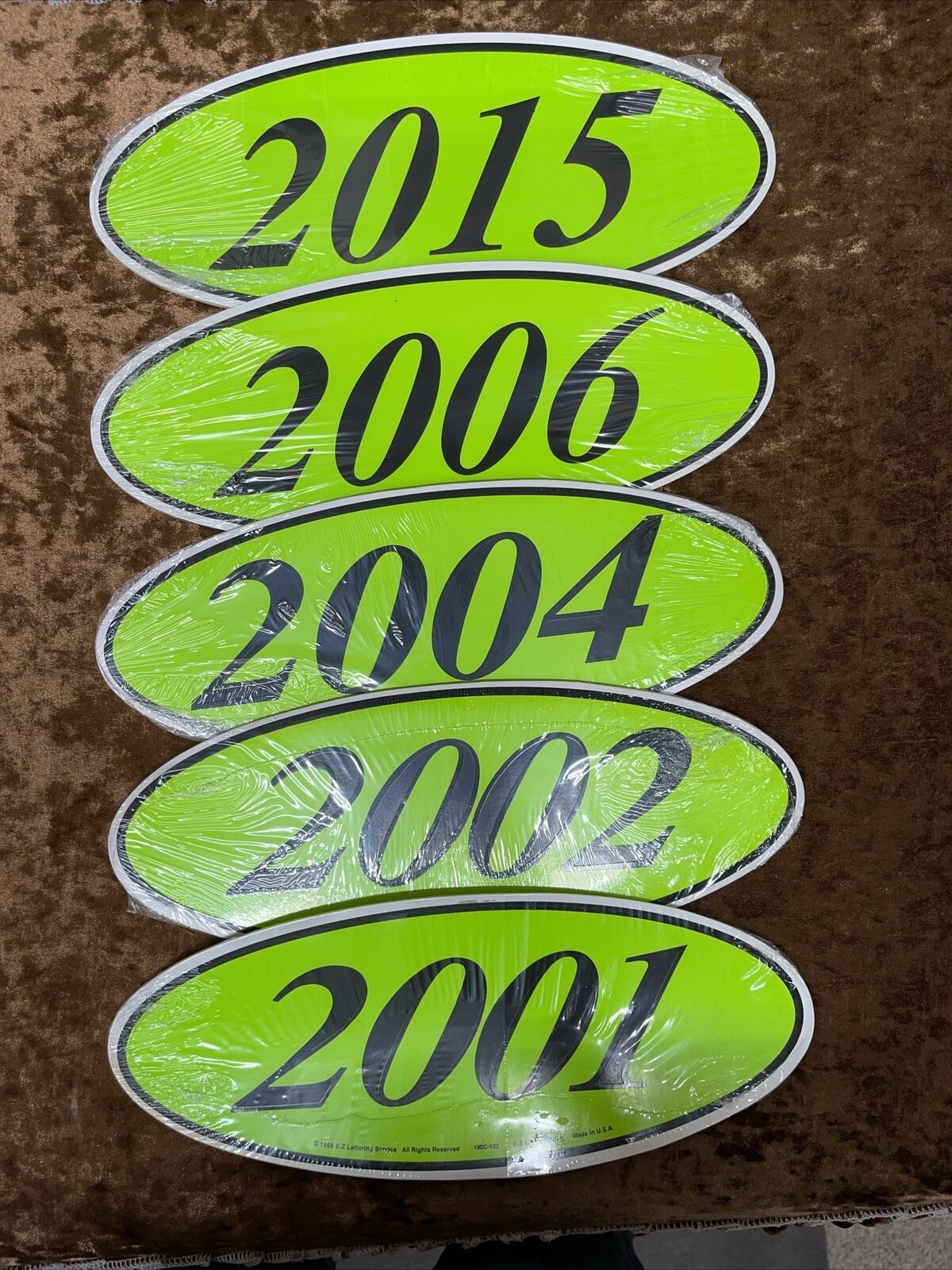 01,02,04,06,and 15 CAR DEALER OVAL MODEL YEAR WINDSHIELD DECALS 1 DOZEN OF EACH