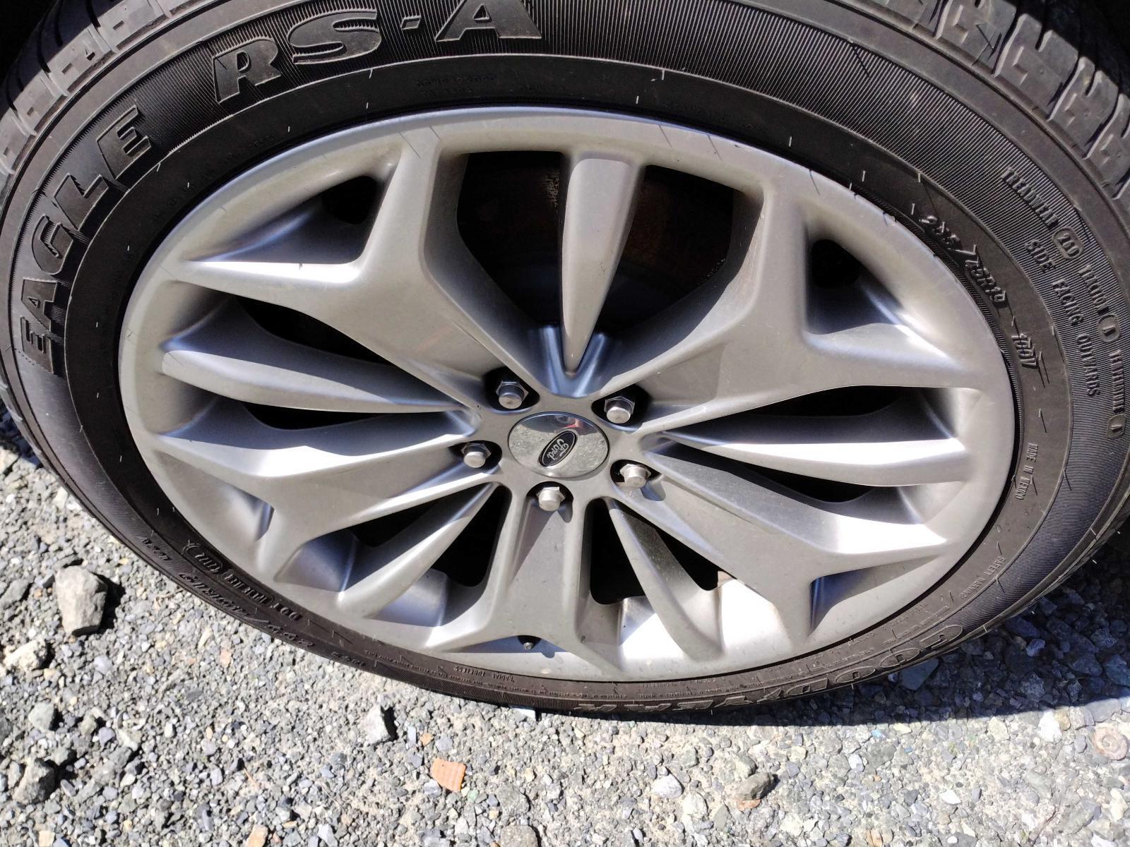 Used Wheel fits: 2013 Ford Taurus 19x8-1/2 aluminum TPMS 10 spoke 5 solid Y and