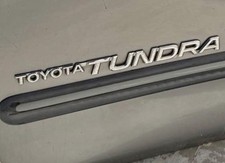One 2000-2006 TOYOTA TUNDRA SIDE DOOR BADGE NAME OEM picture
