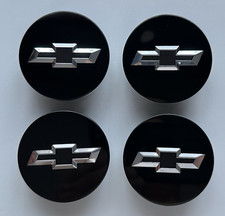 A SET OF (4) BLACK CHEVY CAMARO ETC ETC ETC WHEEL HUB CENTER CAPS EMBLEM. picture