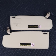 2000-2005 Volkswagen Passat Driver Passenger Side Sun Visor Set Beige OEM picture