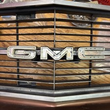 Original 1971-1972 GMC Sprint Grille Emblem - Complete OEM with Mounting Bracket picture