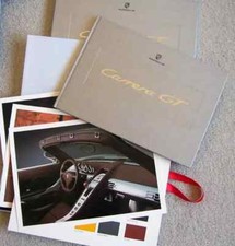 NEW PORSCHE CARRERA GT FACTORY HARDBOUND BROCHURE IN IT'S ORIGINAL SEALED BOX picture