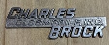 Vintage Metal Charles Brock Oldsmobile Inc. Car Automobile Dealership Emblem picture