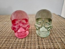 Two Small Skulls, Like Glass, One Smokey Clear, One Red Decorations picture