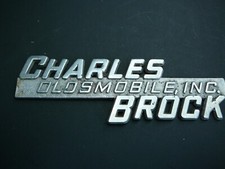 Vintage CHARLES BROCK OLDSMOBILE, INC. Car Dealership Badge Emblem picture