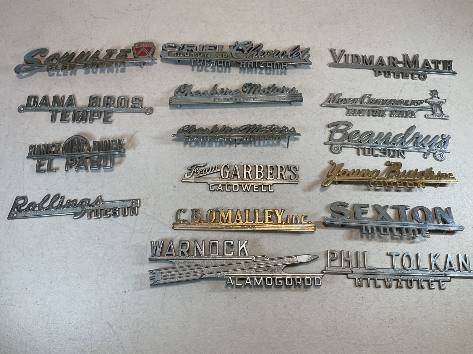 Lot of 16 Vintage 1950's-60s Car Dealer Metal Emblems