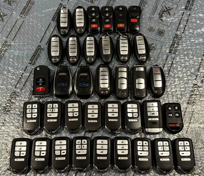 OEM-LOT OF 36 HONDA, NESSAN, , SUBARU, MAZDA, ACURA, INFINITI SMART REMOTES KEYS