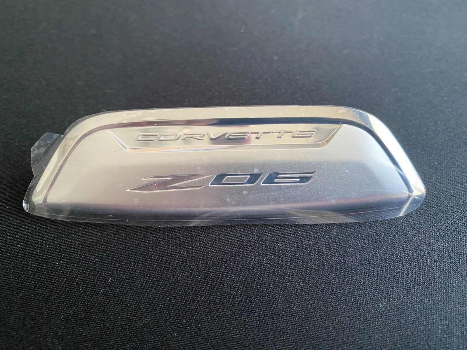 2023 Genuine OEM Chevrolet Corvette Z06 Rear Console Emblem 87816976 NEW