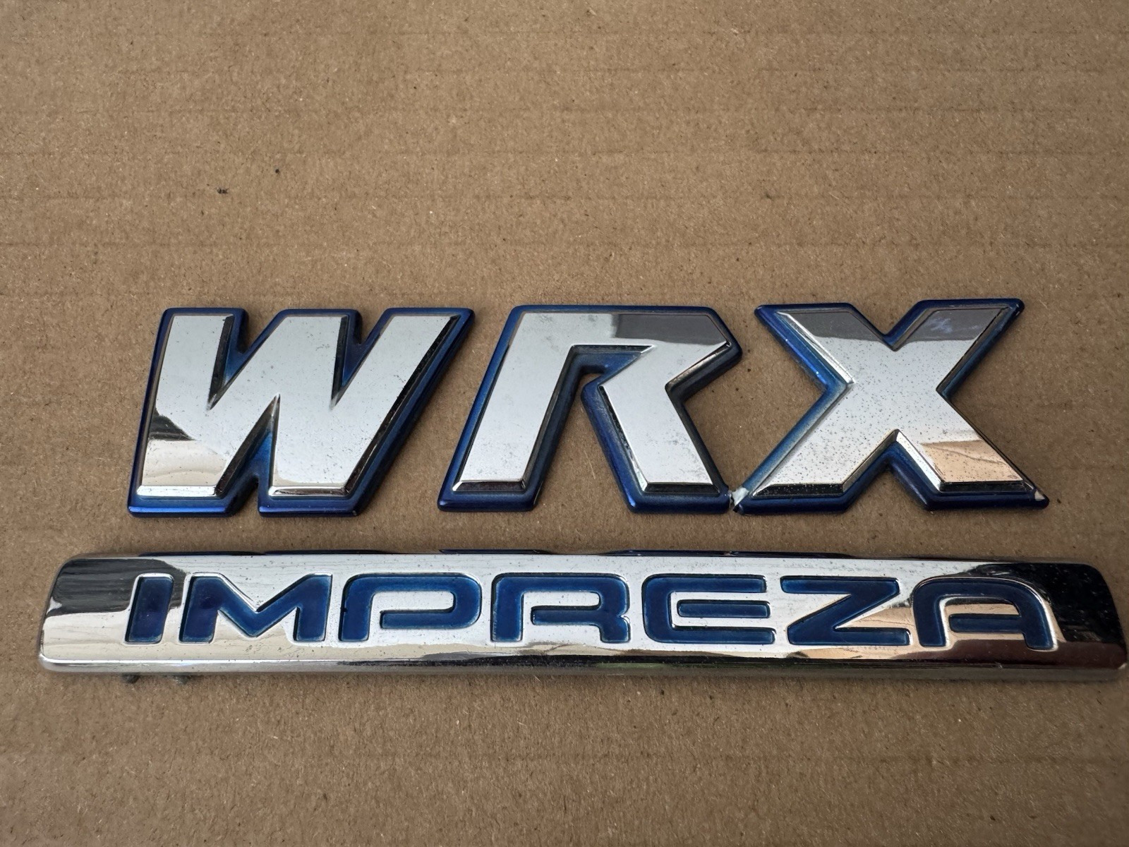 FREE SHIPPING OEM 2002-2007 Subaru Impreza WRX Rear Emblem Badge FREE SHIPPING OEM 2002-2007 Subaru Impreza WRX Rear Emblem Badge