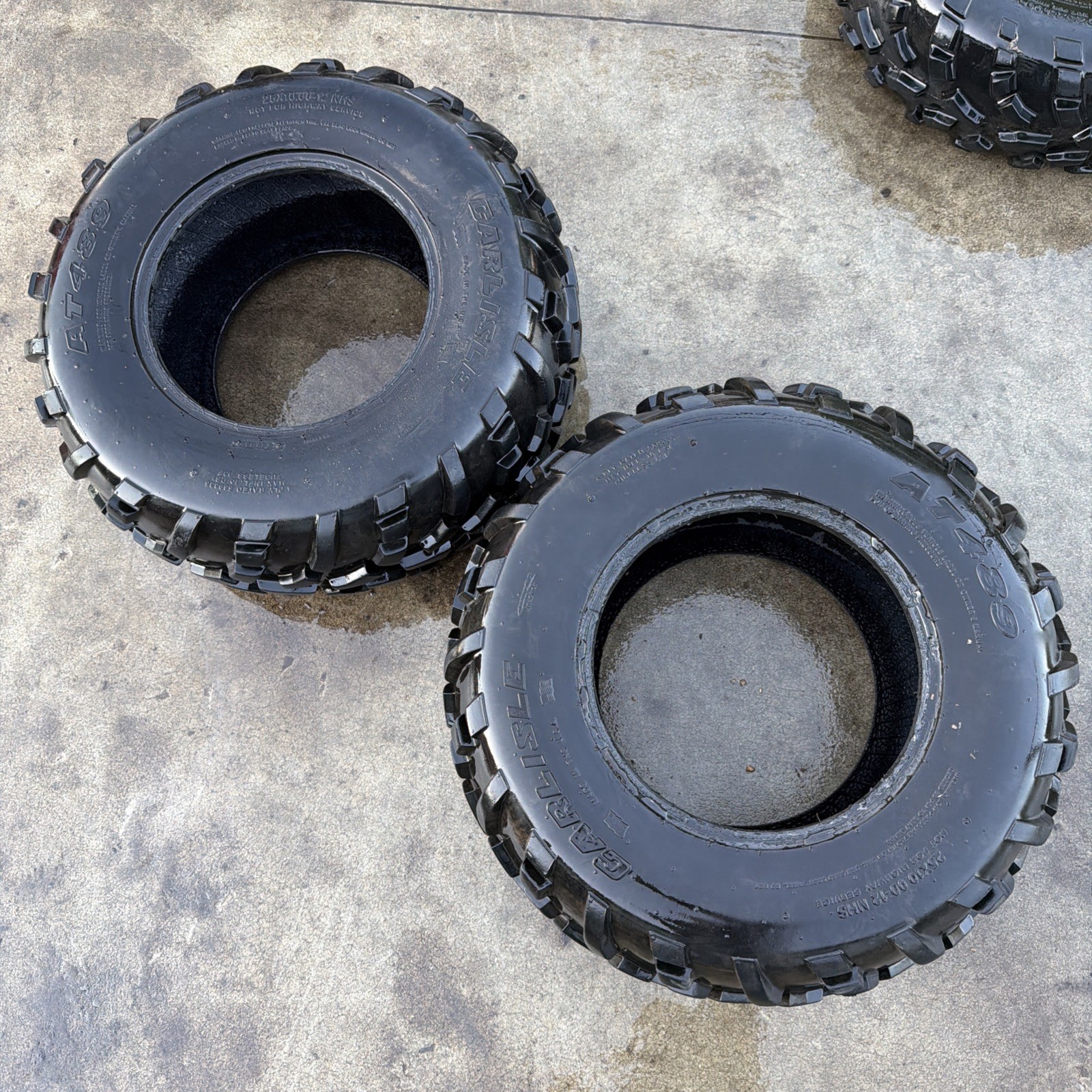 SET OF TWO REAR CARLISLE AT489 25x10.00-12NHS GOOD TREAD OEM