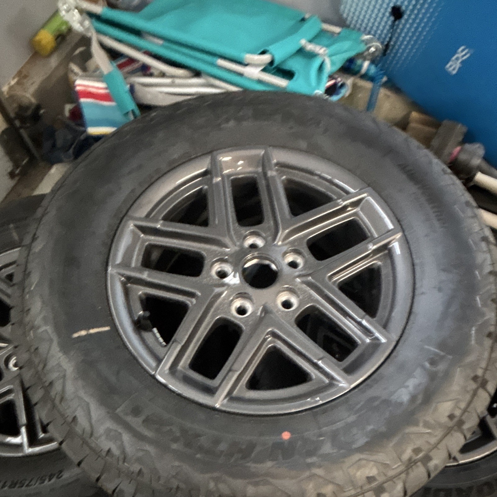 complete set of 5 Jeep OEM wheels and tires, including the full-size spare.