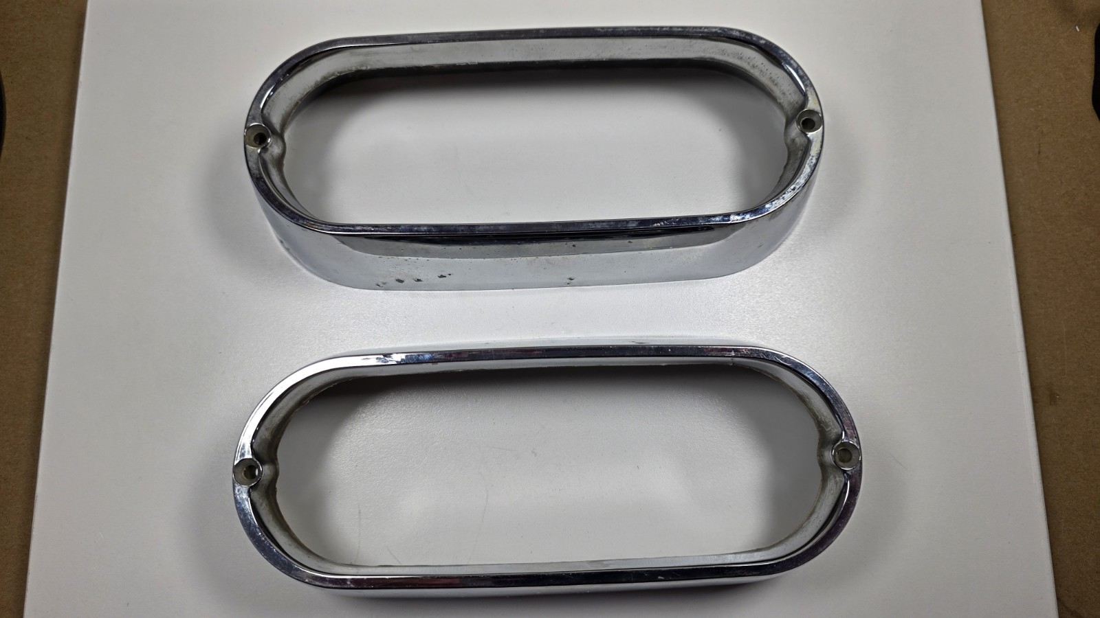 PAIR OF 1961-62 PONTIAC TEMPEST SAFARI WAGON CHROME TAIL LIGHT BEZELS #5952448 PAIR OF 1961-62 PONTIAC TEMPEST SAFARI WAGON CHROME TAIL LIGHT BEZELS #5952448
