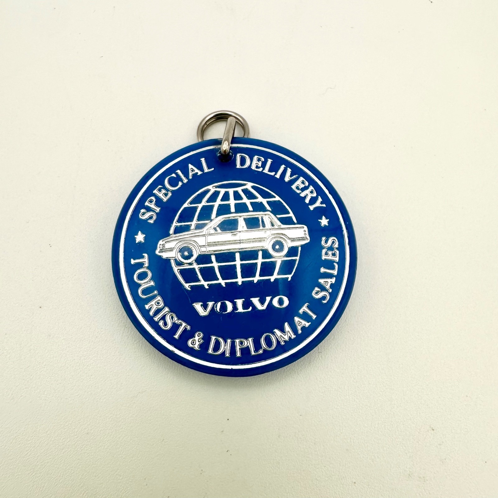 Vintage 90s VOLVO KEYCHAIN Special Delivery Tourist & Diplomat Sales Blue Silver