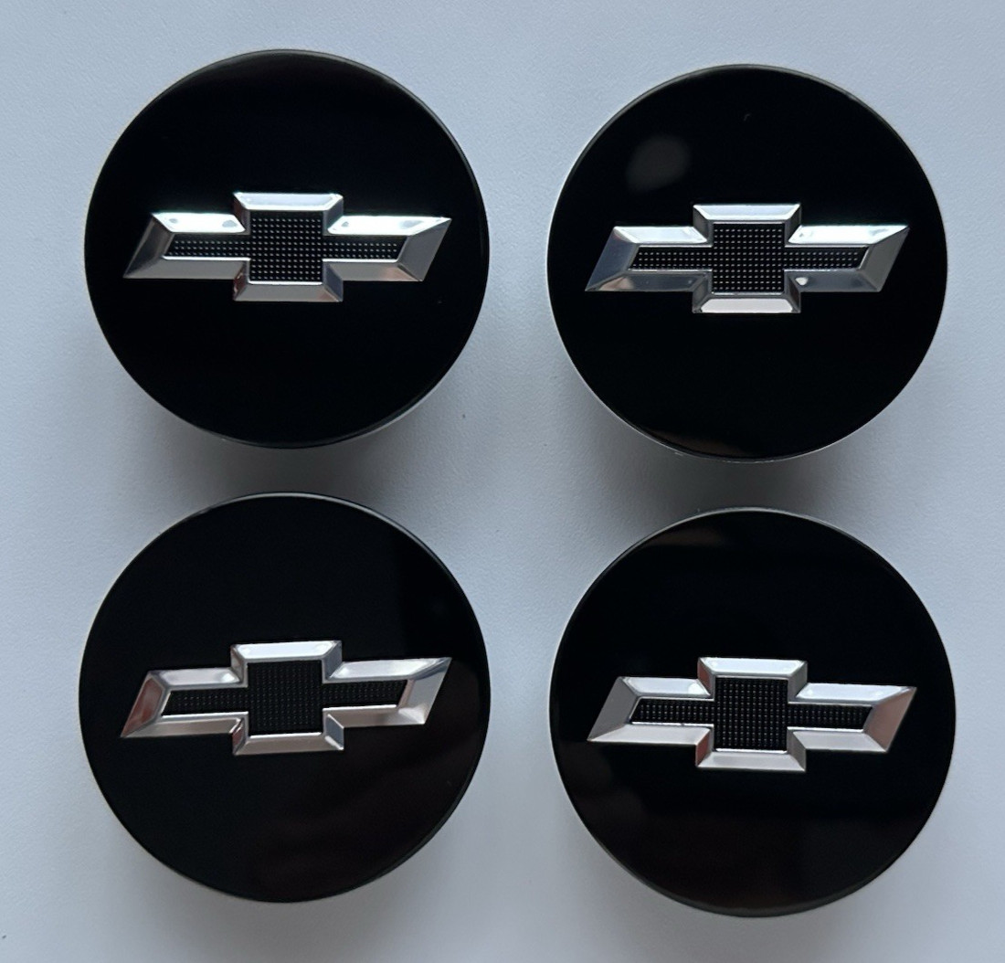 A SET OF (4) BLACK CHEVY CAMARO ETC ETC ETC WHEEL HUB CENTER CAPS EMBLEM.