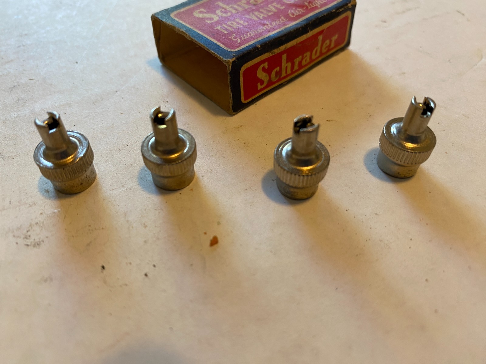 (4) vintage Schrader tire valve caps