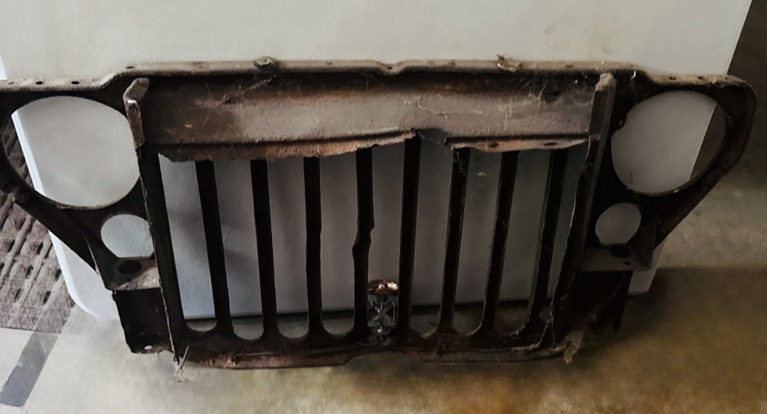 Authentic WWII-era military Jeep front grille with original age, wear, rust, ETC