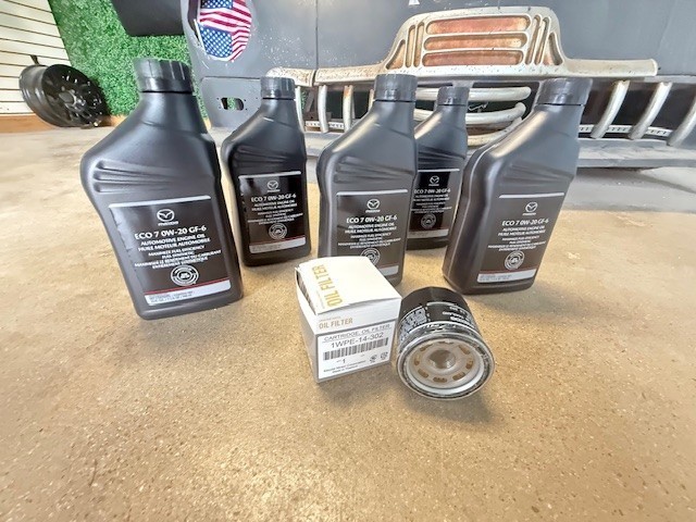 Mazda Skyactiv Oil Change Kit  (5) 0000-77-EC07-QT  & (1) Oil Filter 1WPE14302