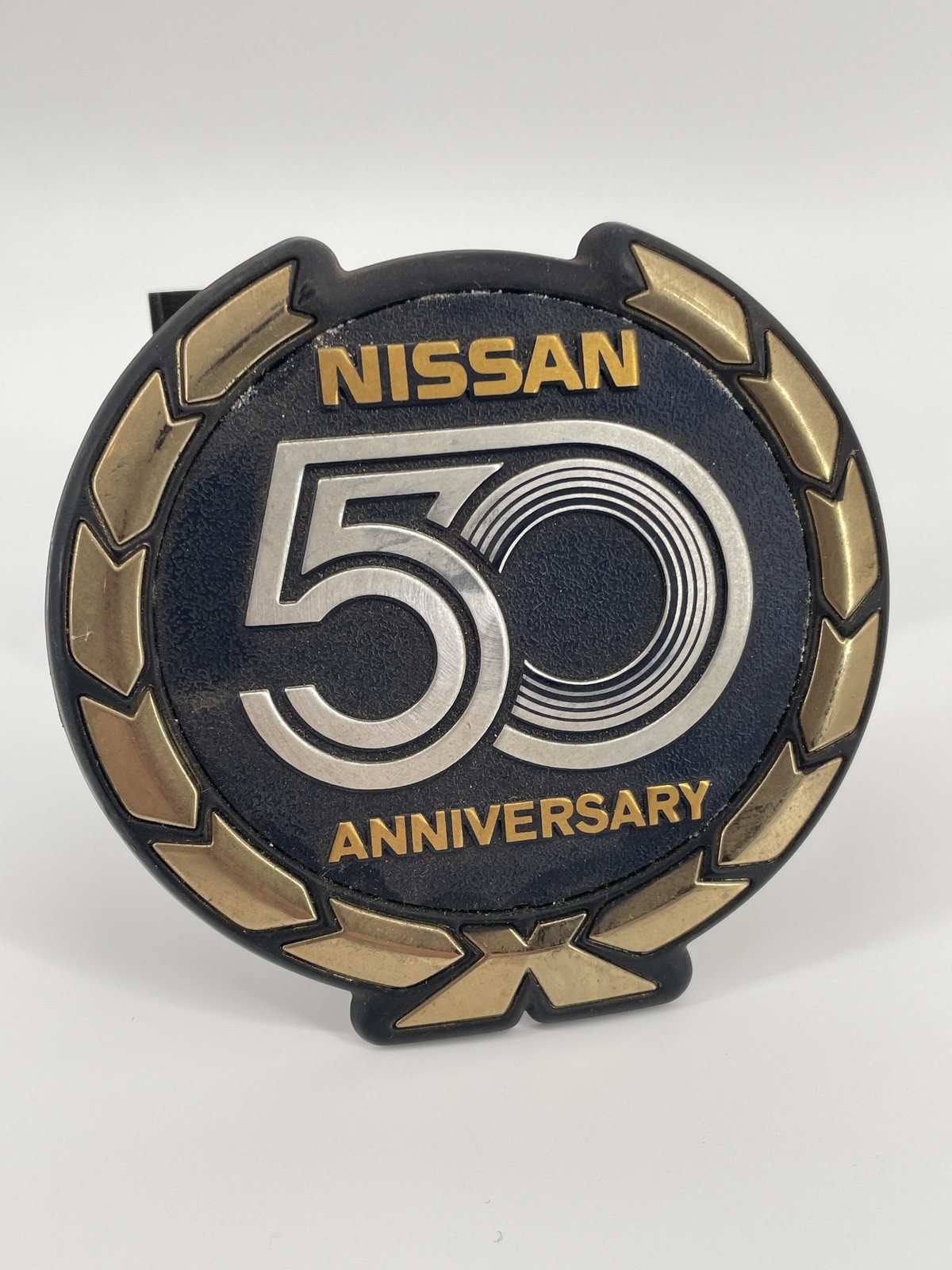 Vintage Nissan 50th Anniversary Emblem Badge 3.5 inches wide with studs Vintage Nissan 50th Anniversary Emblem Badge 3.5 inches wide with studs