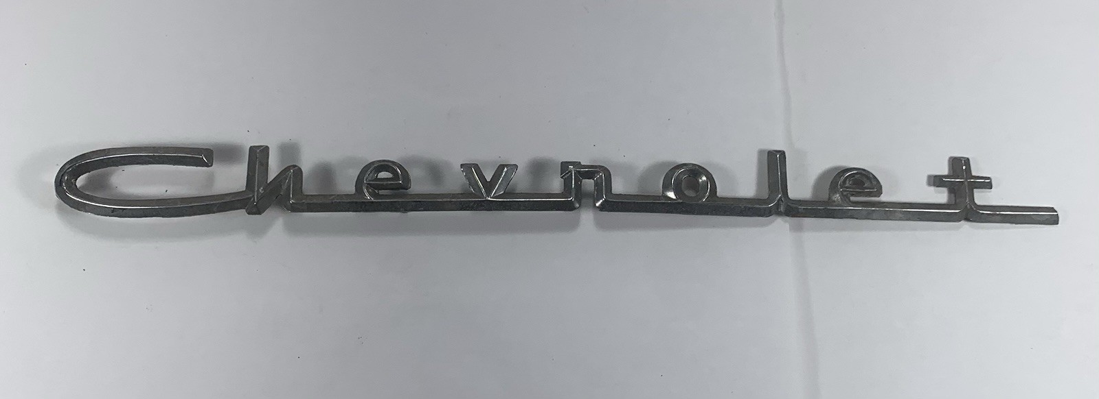 1957 Chevy 150 210 Fender Hood Quarter Panel Trunk Emblem Chevrolet Script OEM