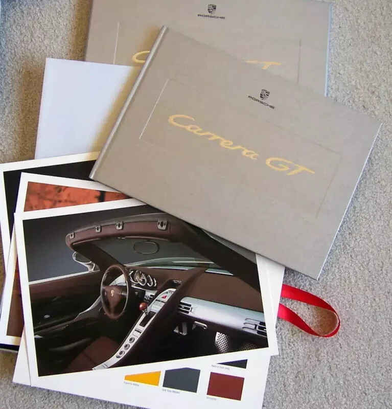 NEW PORSCHE CARRERA GT FACTORY HARDBOUND BROCHURE IN IT'S ORIGINAL SEALED BOX