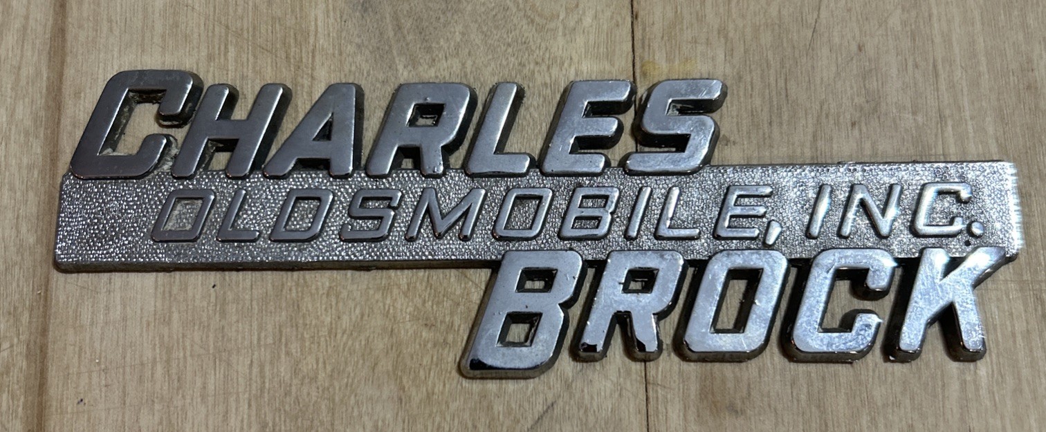 Vintage Metal Charles Brock Oldsmobile Inc. Car Automobile Dealership Emblem Vintage Metal Charles Brock Oldsmobile Inc. Car Automobile Dealership Emblem