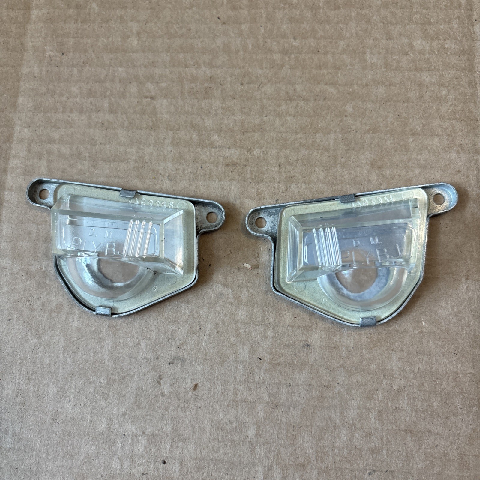 NOS 57-59 Chrysler Dodge Plymouth License Lamp Lens Covers  1753373 1753374