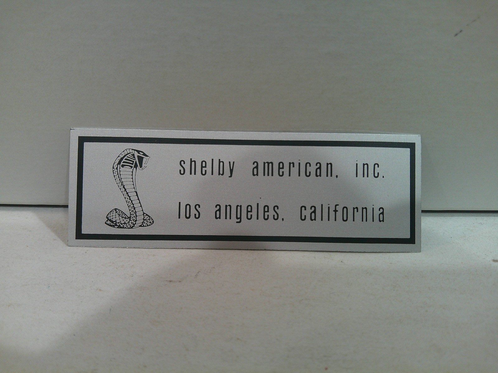 NOS OEM 1967 Shelby 2-Line Scuff Plate Label Part # S7MS-6310130-A  Never Used