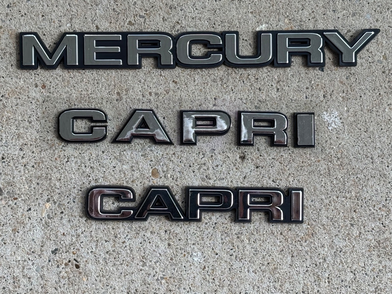 1979-1986 MERCURY CAPRI HOOD LETTER SET & DECKLID EMBLEMS 1979-1986 MERCURY CAPRI HOOD LETTER SET & DECKLID EMBLEMS