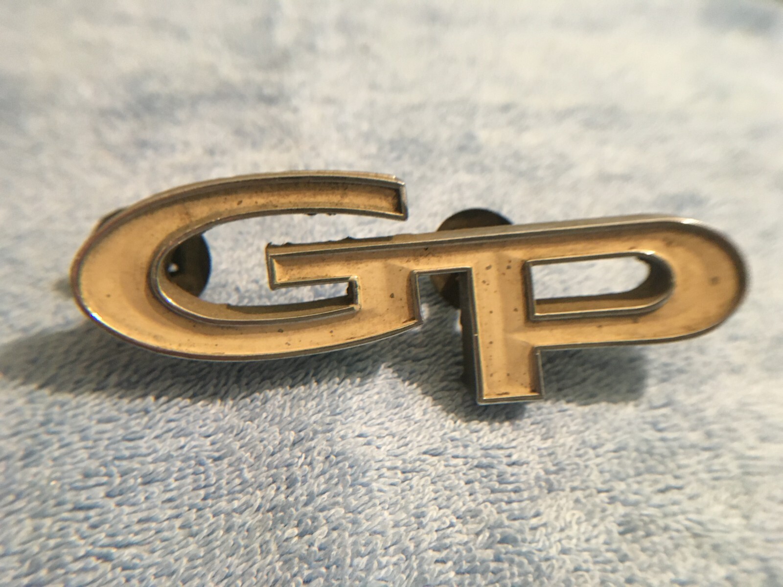 GM 1967-68 PONTIAC GRAND PRIX SCRIPT GP EMBLEM BADGE # 1 9784506 66218 OEM PART