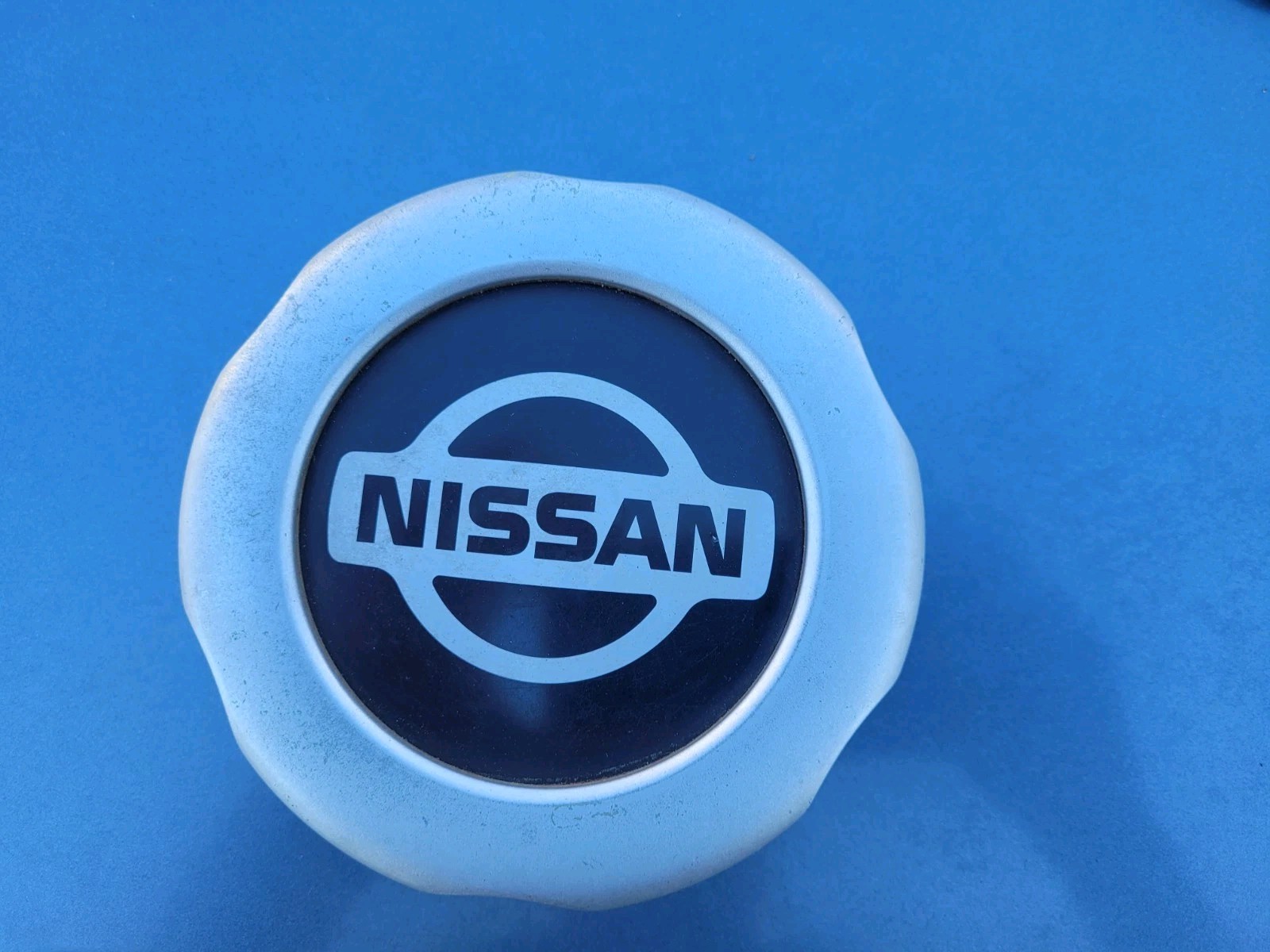 1998-2002 Nissan Frontier Plastic Center Cap OEM 1998-2002 Nissan Frontier Plastic Center Cap OEM