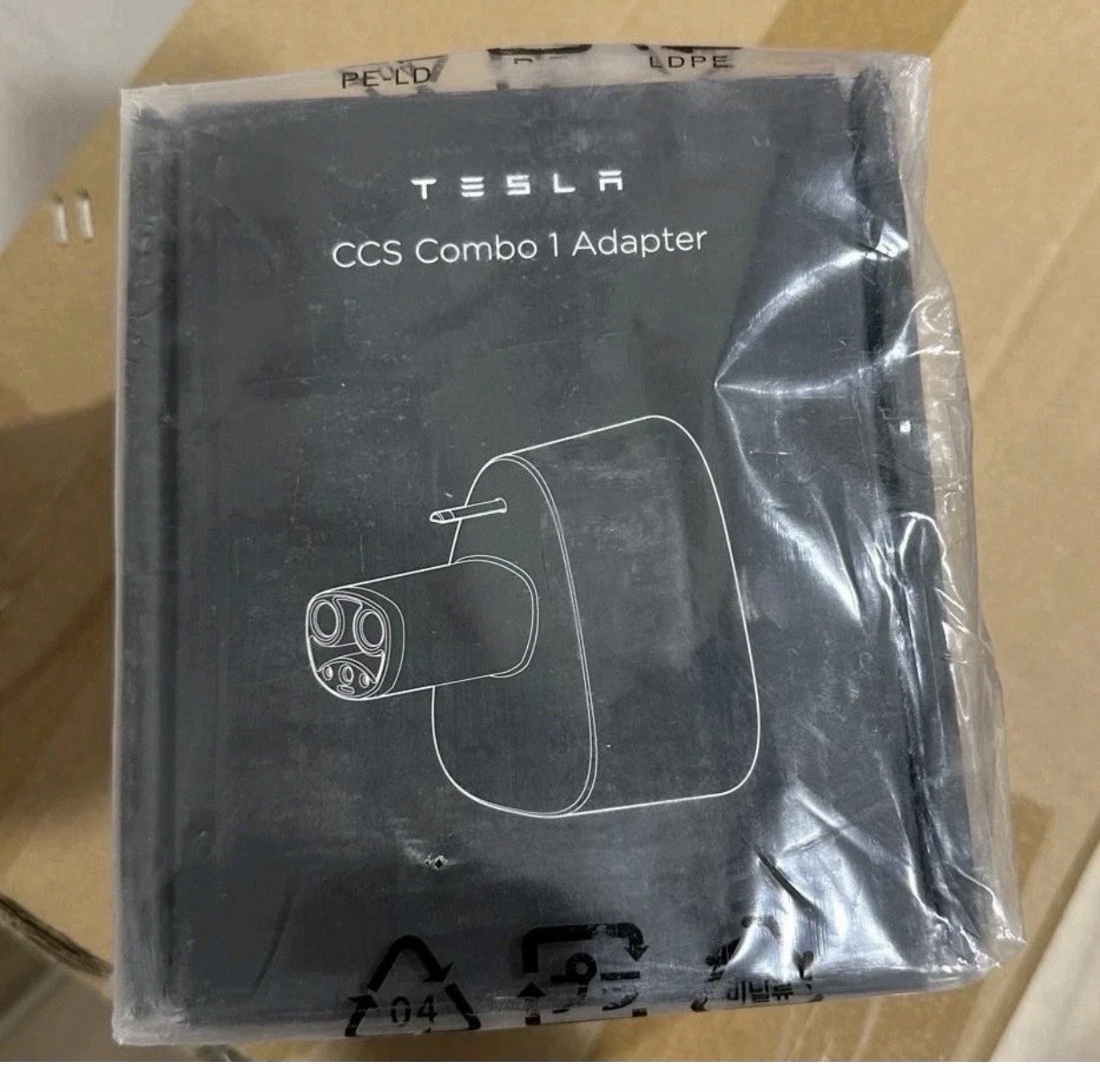 Tesla CCS Combo 1 (CCS1) Adapter (Part No 1656565-00-A) NEW & Sealed 100% OEM Tesla CCS Combo 1 (CCS1) Adapter (Part No 1656565-00-A) NEW & Sealed 100% OEM