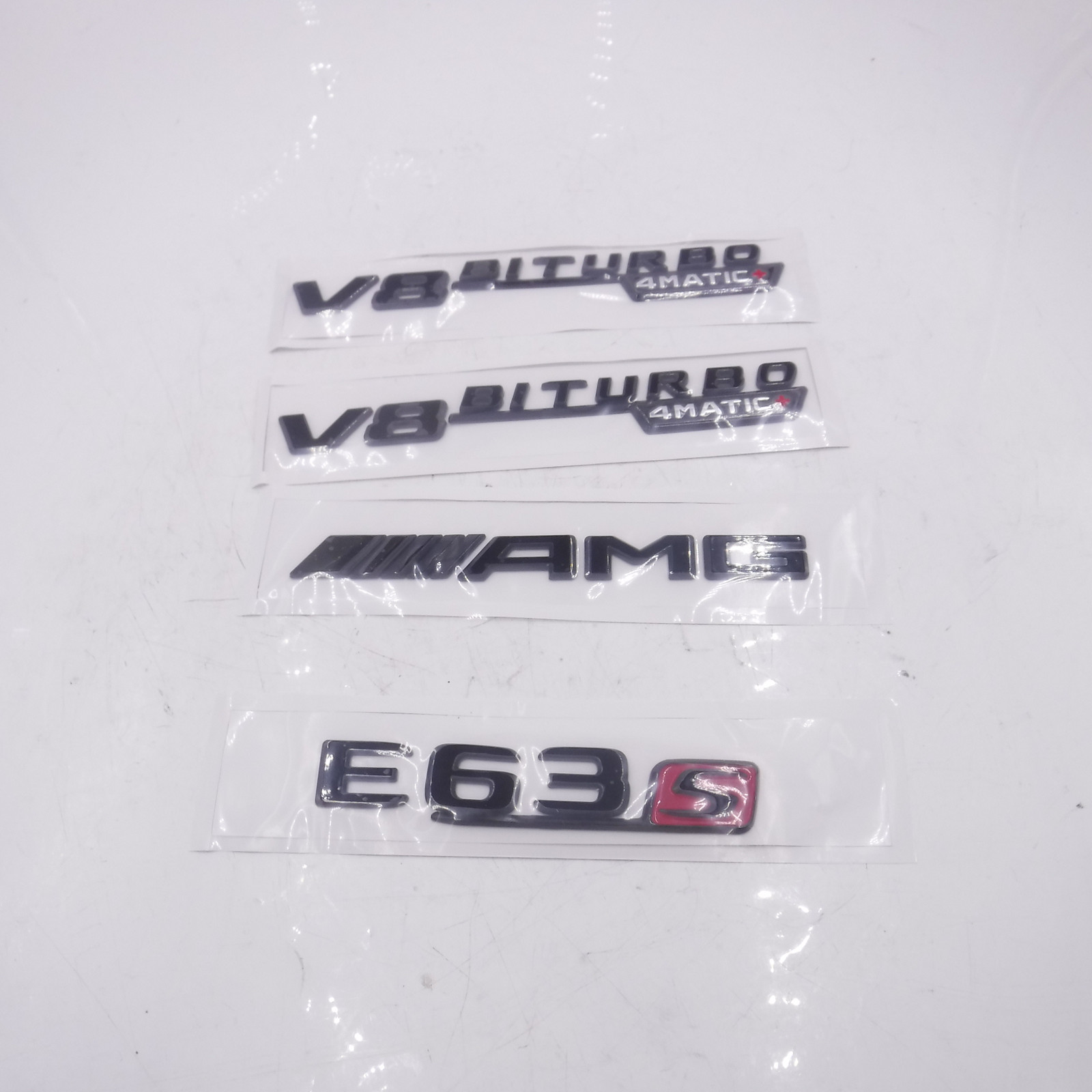 Genuine OEM Mercedes-Benz Black E63S AMG V8 Biturbo 4Matic Emblem Badges Genuine OEM Mercedes-Benz Black E63S AMG V8 Biturbo 4Matic Emblem Badges