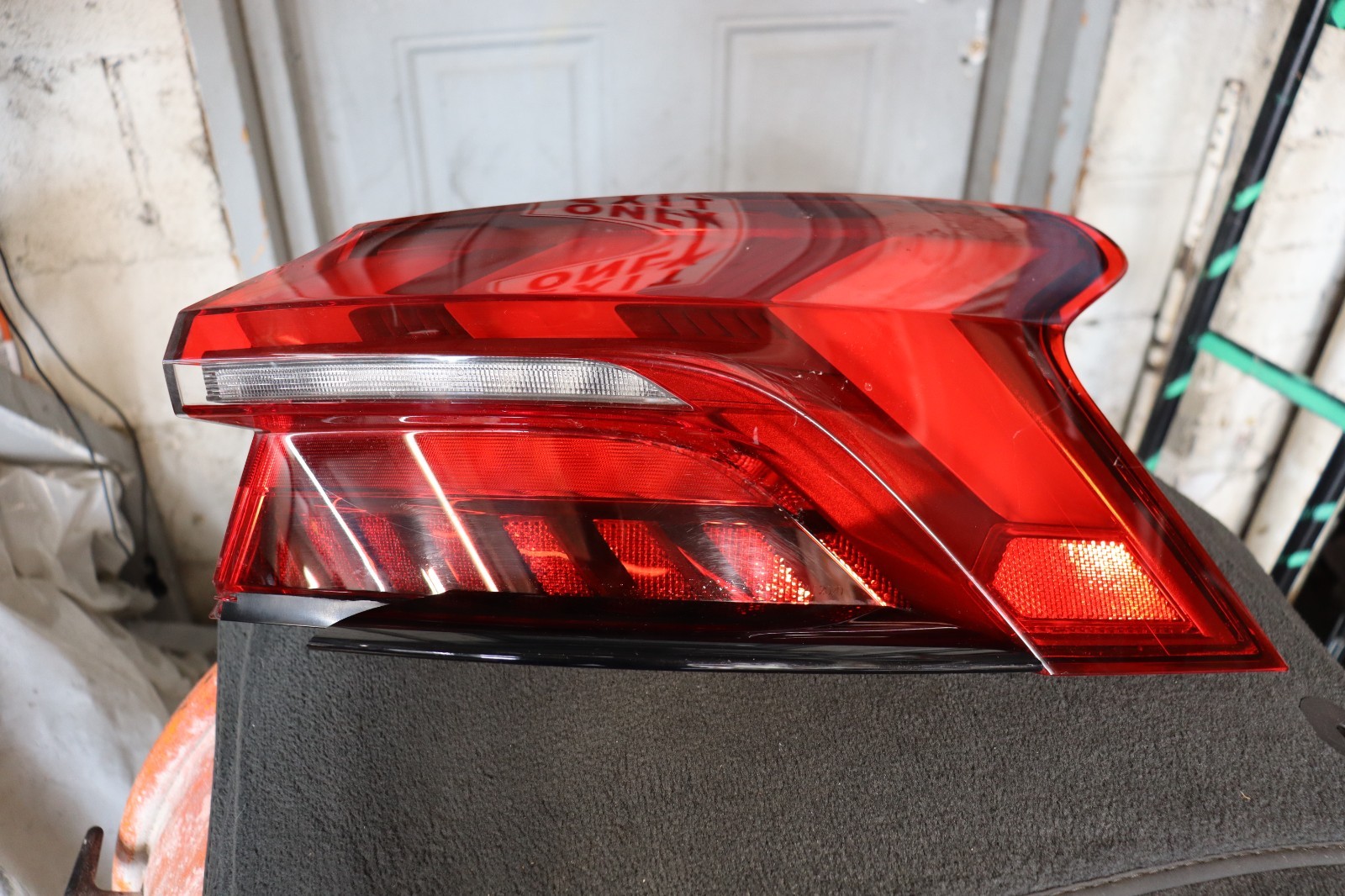 Genuine OEM factory passenger-side (Right) outer tail light assemb