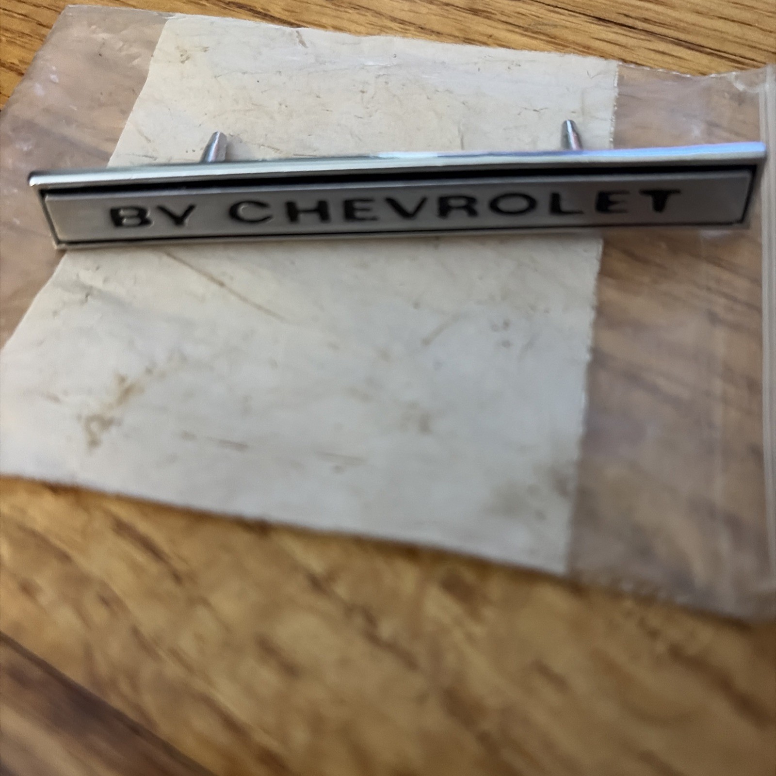 Original 1969 Chevelle Header Panel Emblem Badge Script BY CHEVROLET no. 3942788